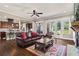 Open living room features hardwood floors, fireplace, and access to the backyard at 105 Laurel Canyon Trl, Canton, GA 30114