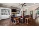 Comfortable living room with built-in shelving, stone fireplace, and hardwood flooring at 105 Laurel Canyon Trl, Canton, GA 30114