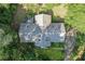 An aerial view of the home's roof, surrounded by lush trees at 1252 Grist Mill Dr, Acworth, GA 30101