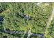 Aerial view of a charming home nestled among mature trees on a sprawling lot at 1252 Grist Mill Dr, Acworth, GA 30101