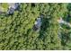 Aerial view of a lovely home hidden among a lush green forest at 1252 Grist Mill Dr, Acworth, GA 30101