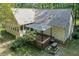 Aerial view of the backyard showing deck, landscaping and wooded area at 1252 Grist Mill Dr, Acworth, GA 30101