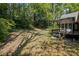 Home exterior with a deck and a gazebo, surrounded by foliage and mature trees at 1252 Grist Mill Dr, Acworth, GA 30101