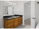 Bathroom with a granite countertop vanity and wood cabinets at 1252 Grist Mill Dr, Acworth, GA 30101