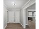 Hallway featuring classic trim, neutral paint and offering a view into a modern kitchen at 1252 Grist Mill Dr, Acworth, GA 30101