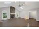 Open living room featuring a stone fireplace, vaulted ceilings, and hardwood floors at 1252 Grist Mill Dr, Acworth, GA 30101