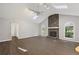 Spacious living room featuring a stone fireplace, vaulted ceiling, skylights, and elegant hardwood floors at 1252 Grist Mill Dr, Acworth, GA 30101