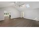 Bright living room featuring vaulted ceilings, hardwood floors, skylights, and an open floor plan at 1252 Grist Mill Dr, Acworth, GA 30101