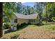 This two-story home has a sunroom with many windows and an attached 2 car garage at 1252 Grist Mill Dr, Acworth, GA 30101