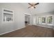 Inviting sunroom featuring hardwood floors, large windows, and a glass-paneled door leading to the exterior at 1252 Grist Mill Dr, Acworth, GA 30101