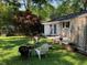 Inviting backyard with patio area, outdoor seating, and a well-maintained lawn at 2920 Appling Dr, Atlanta, GA 30341