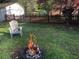 Outdoor space with a fire pit in a tire and a partial view of a fenced yard at 2920 Appling Dr, Atlanta, GA 30341