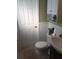 Compact bathroom with white cabinets, toilet, and vanity sink at 2920 Appling Dr, Atlanta, GA 30341