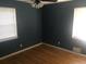 Bedroom with hardwood floors and natural light from two windows at 2920 Appling Dr, Atlanta, GA 30341