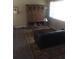 Cozy living room with large cabinet, patterned rug, and comfortable seating at 2920 Appling Dr, Atlanta, GA 30341
