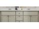 Bathroom vanity with double sinks, white countertop and neutral cabinetry at 516 Almere Dr, Hampton, GA 30228