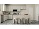 Modern kitchen with stainless steel appliances, granite countertops, and a convenient island with seating at 516 Almere Dr, Hampton, GA 30228
