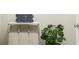 Functional laundry room with storage bin, bench, and greenery enhancing a clean and organized space at 516 Almere Dr, Hampton, GA 30228