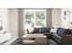Comfortable living room featuring a sectional sofa, TV console, and stylish decor at 516 Almere Dr, Hampton, GA 30228