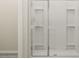 A modern shower with a glass door and tiled walls offers a clean aesthetic at 516 Almere Dr, Hampton, GA 30228