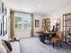 Bright office features modern decor, stylish furniture, and a view of the neighborhood at 619 Catesby Ter, Dacula, GA 30019
