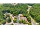 Expansive aerial shot showing the community amenities like the pool and tennis courts nestled among lush greenery at 6236 Millstone Trl, Douglasville, GA 30135