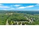 Aerial view of a neighborhood nestled among lush green trees at 6236 Millstone Trl, Douglasville, GA 30135