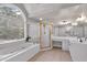 The ensuite bathroom has double vanity, a large garden tub, and a separate shower at 6236 Millstone Trl, Douglasville, GA 30135