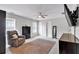Bedroom with a chair, bed, area rug, overhead lighting, and an entertainment center at 6236 Millstone Trl, Douglasville, GA 30135