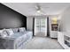 Bright bedroom featuring a daybed, bookshelf and white dresser with plenty of natural light at 6236 Millstone Trl, Douglasville, GA 30135