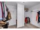 Walk-in closet offering ample storage with racks and shelves for clothing at 6236 Millstone Trl, Douglasville, GA 30135