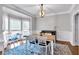 Bright dining room with hardwood floors, wainscoting, and bay windows at 6236 Millstone Trl, Douglasville, GA 30135