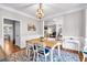 Traditional dining room with wood table, chairs, and decorative lighting at 6236 Millstone Trl, Douglasville, GA 30135