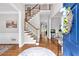 Inviting foyer with hardwood floors, staircase, and stylish decor at 6236 Millstone Trl, Douglasville, GA 30135