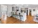 Bright and modern kitchen with a breakfast bar featuring seating for four, stainless appliances and hardwood floors at 6236 Millstone Trl, Douglasville, GA 30135