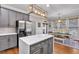 Modern kitchen with stainless appliances, an island and breakfast nook with backyard views at 6236 Millstone Trl, Douglasville, GA 30135