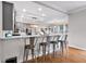 Modern kitchen featuring a breakfast bar with seating for four and views to the breakfast nook at 6236 Millstone Trl, Douglasville, GA 30135