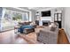 Cozy living room showcasing a fireplace, built-in shelves, and large windows at 6236 Millstone Trl, Douglasville, GA 30135
