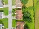 An aerial view of a charming home with mature trees, green lawns and beautiful street at 1030 Carriage Trace Cir, Stone Mountain, GA 30087