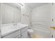 Clean bathroom featuring a tub-shower combination and vanity with storage at 1030 Carriage Trace Cir, Stone Mountain, GA 30087