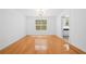 Dining room features pristine white walls, hardwood floors, and natural lighting at 1030 Carriage Trace Cir, Stone Mountain, GA 30087
