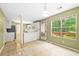 Open-concept kitchen and breakfast nook with large windows and outdoor access at 1030 Carriage Trace Cir, Stone Mountain, GA 30087