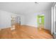 Bright living room boasts wood floors with an open floor plan and natural light at 1030 Carriage Trace Cir, Stone Mountain, GA 30087