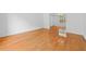 Spacious living room boasts gleaming hardwood floors and abundant natural light at 1030 Carriage Trace Cir, Stone Mountain, GA 30087