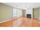 Spacious living room featuring a classic fireplace, tile floors and natural light at 1030 Carriage Trace Cir, Stone Mountain, GA 30087