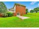 Backyard with a walkout patio and lush green lawn at 2071 Habersham Cir, Covington, GA 30014
