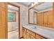 Traditional bathroom features wood cabinetry and neutral colors at 2071 Habersham Cir, Covington, GA 30014