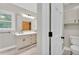 Bright bathroom features a large vanity with modern fixtures and wood-look flooring at 2071 Habersham Cir, Covington, GA 30014