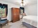 Bedroom with a large window and wood armoire at 2071 Habersham Cir, Covington, GA 30014