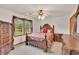 Bedroom featuring a decorative bed frame and dresser set, complemented by a large window at 2071 Habersham Cir, Covington, GA 30014